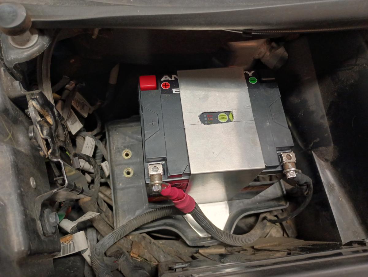 An Antigravity ATX30HD battery partially mounted in a C5 Corvette.