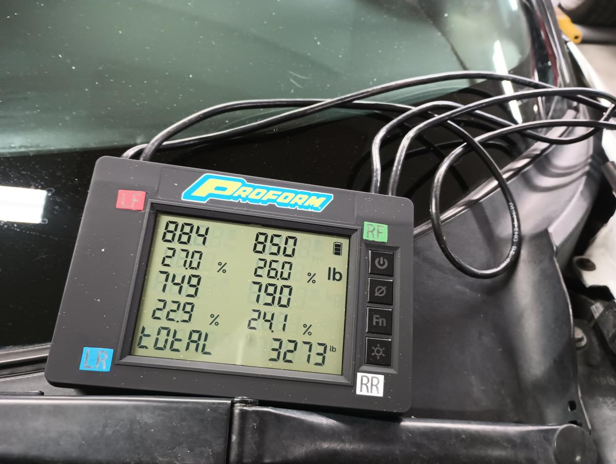 Shred Jesse's C5 Corvette on corner scales after battery. Shows a 29lb reduction!