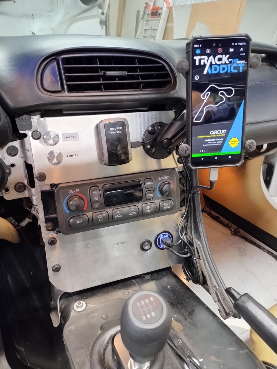 C5 Corvette with center console removed and a track addicts USB setup with GPS in it's place.