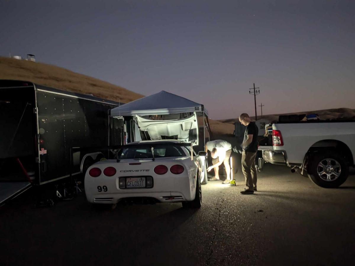 Jesse's C5 corvette up on jackstands at dusk for Tech2 Abs bleeding