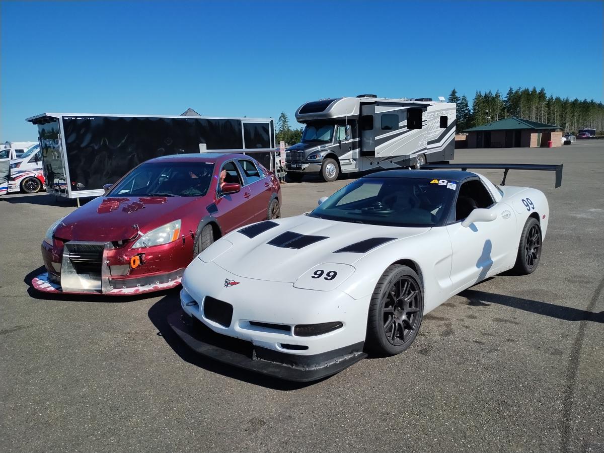 C5 Corvette and Honda Accordian next each other in the cold pits at the Ridge Motorsports Park